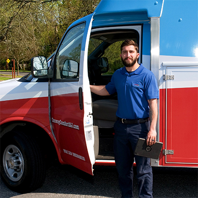 Technician exiting company van